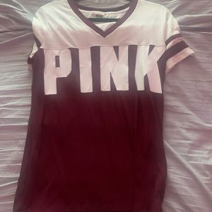 a white and maroon short sleeve